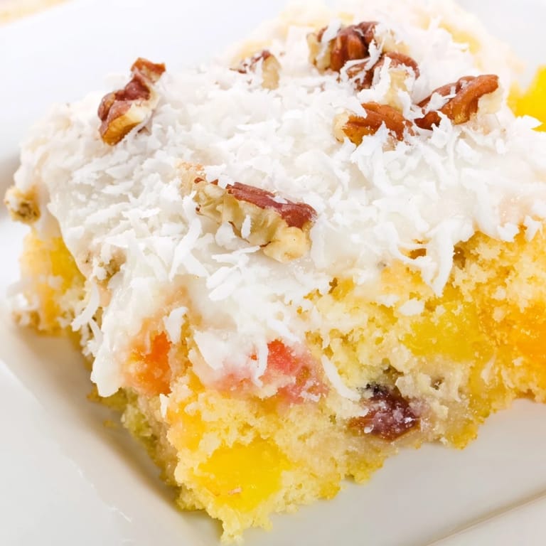 American fruit cocktail cake with a creamy coconut topping, a delicious dessert with a light and fruity flavor.