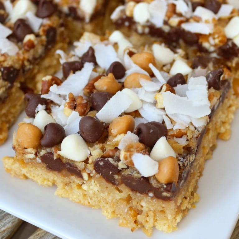Sweet and chewy Magic Cookie Bars, loaded with chocolate chips and coconut, baked to perfection.