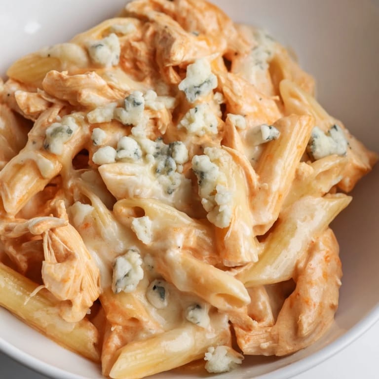 Serve Buffalo Chicken Pasta with a side of crisp celery sticks and a cold lager for a complete meal.
